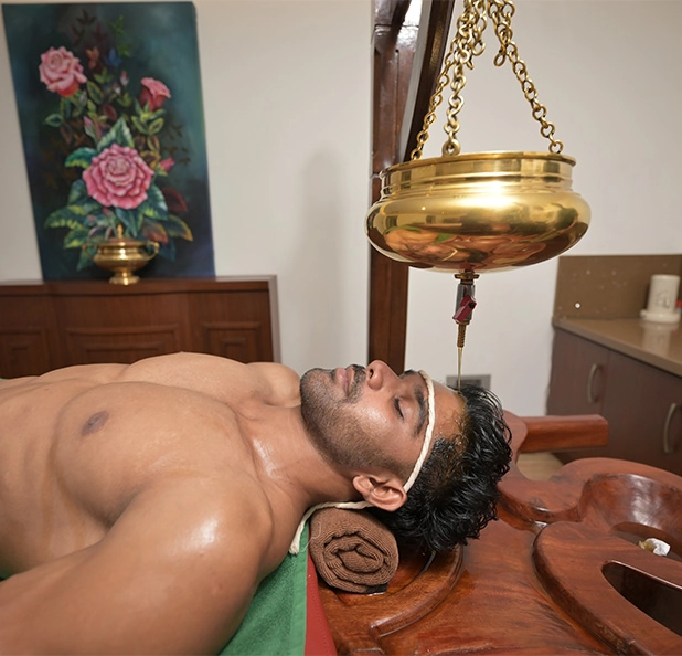 Shirodhara Ayurvedic therapy supporting post-trauma recovery and rehabilitation at Tigris Valley