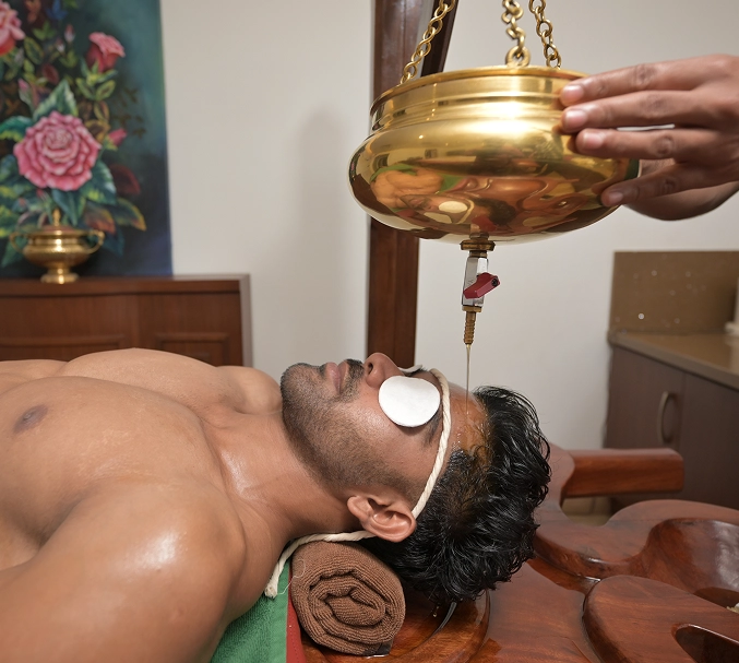 Relaxing Shirodhara therapy session at Tigris Valley Kerala